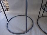 two tables that are sitting next to each other on the floor