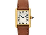 une montre Cartier en or jaune 18 carats avec des chiffres romains