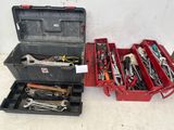 many tools in a tool box on the floor
