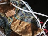 a bag with a tag on it sitting in a suitcase