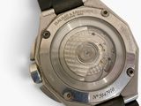 a close up of a watch on a white surface