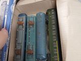 a box full of toy trains sitting on top of a table