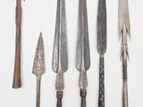 five different types of knives on a white surface