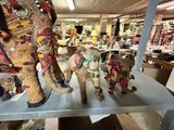 many different colored elephants on a shelf in a room