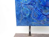 painting of a blue bird on a metal stand with a white background
