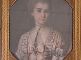 portrait of a woman in a pink dress with a gold frame