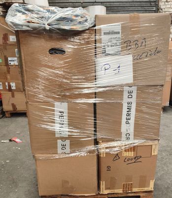 a stack of boxes sitting on a pallet in a warehouse