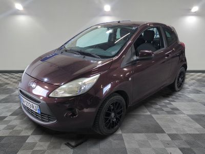 a picture of a maroon ford fiesta parked on a checkered floor
