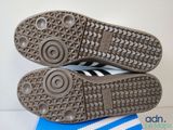 a pair of shoes that are on top of a blue and white box