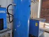 a large blue tank sitting next to a small blue machine