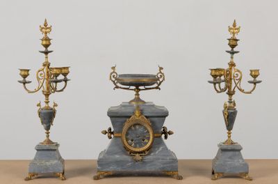 three different types of clocks on a table