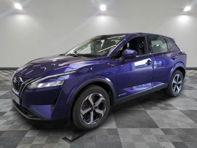 a purple nissan suv parked on a checkered floor in a garage