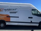 a white van that is parked in a parking lot
