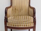 an image of a chair with a striped upholstered seat