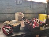 a table with many tools on it in a garage