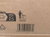 a cardboard box with a picture of a person and a trash can