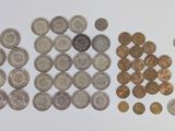 a lot of coins that are on the table