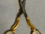 a pair of scissors that are sitting on a table