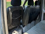 two seats in the back of a van that is parked