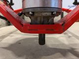 a close up view of a red bicycle with a red handlebar