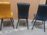 three chairs are lined up in a row on a concrete floor