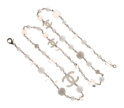 a close up of a rosary on a white background