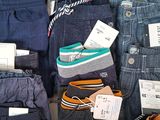 many different types of jeans on display in a store