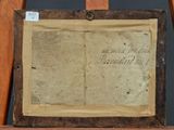 a close up of an old book on a wooden easel