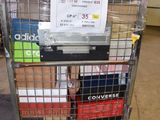 a metal cart with many boxes on it in a warehouse