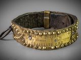 a close up of a gold bracelet with a metal clasp