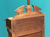 a small wooden pulpit with a cross on top of it