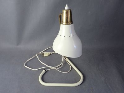 an image of a white lamp with a cord attached to it