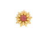 un gros plan d'une broche en forme de fleur jaune au cœur rose