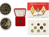 a close up of a box of coins with a picture of a monkey