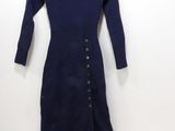 the dress is blue and has buttons on the front