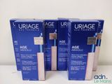 three boxes of uriage age absolu creams on a table