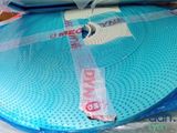 a large blue object on a table that is wrapped in plastic