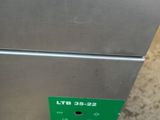 an image of a stainless steel refrigerator sitting on top of a wooden table