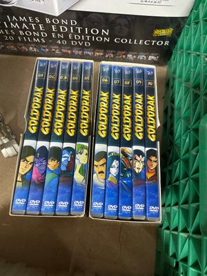 two dvds are stacked on top of each other in a box