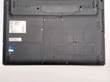 a black laptop with a blue sticker on it