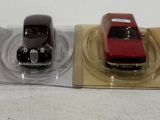three toy cars sitting on top of a plastic tray