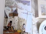 une photo d'un livre sur lequel figure l'image d'un château