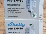 two boxes of energy meters sitting on a table