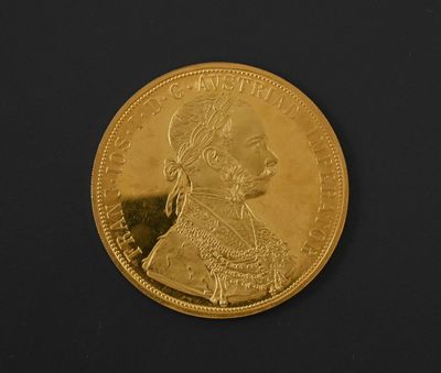 an image of a close up of a gold coin on a black surface