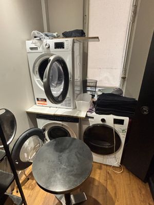 a washer and dryer in a small room