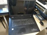 a laptop computer that is sitting on a desk
