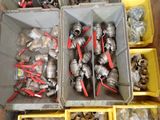 many different types of valves and fittings in the bins