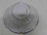 a white plate with a blue edge and a white bowl with a blue rim
