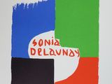 a white poster with a red, green, and blue design on it