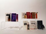 many different types of perfumes displayed on a shelf